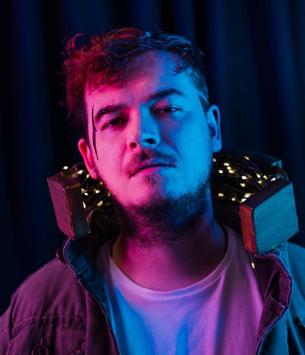 Woman with a calm expression looking forward, light glowing around her.